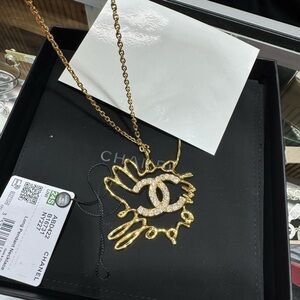 CHANEL Gold Necklace with Crystal Logo can double as a chain belt!